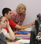 Mrs. Knechtel helps in the computer lab